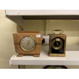 An Elliott clock retailed by Garard & Co, height 14cm, and a modern carriage clock (2).