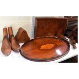 An oval mahogany inlaid tray with shell motif, a square walnut tray, a pair of wooden shoe