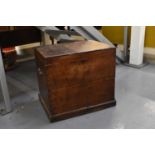 A 19th century oak silver chest with hinge lid enclosing lift-out tray and twin brass carrying