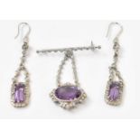 A pair of 18ct white gold diamond and amethyst set earrings and an 18ct white gold pendant/brooch