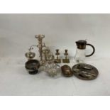 A mixed lot of plated items including large etched glass jug with white metal mounts, a three branch