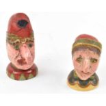 A pair of naive carved painted wooden Punch and Judy figures, height 14cm and 10.5cm.