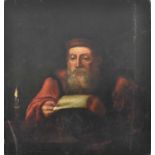 JUDAICA INTEREST; An early 19th century unattributed oil on board study of an elder reading by