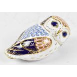 ROYAL CROWN DERBY; a paperweight modelled as an owl with silver stopper, length 13cm.