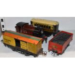 A Hornby O gauge LMS 2270 locomotive with Pullman coach and two wagons (4).