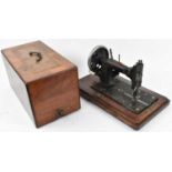 A 19th century mahogany and inlaid cased sewing machine.