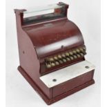 A vintage red painted cash register no.3605422, width 35cm.