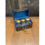 PERFUME BOTTLES; a very pretty set of three perfume bottles with gilt lids in wooden inlaid fitted