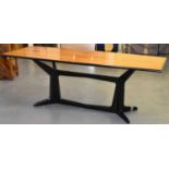 A large retro dining table on ebonised base, 224 x 92cm.