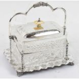 X An Edwardian cut glass and silver plated biscuit jar, with ivory handle.Condition Report: This