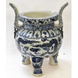 A monumental Chinese blue and white dragon decorated jardiniere modelled as a tripod censer,