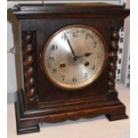 A Victorian oak mantel clock with barleytwist decoration, height 28cm.