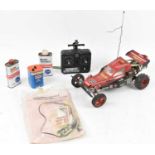 A 1980s Japanese Kyosho Assault 1/10 scale nitro radio-controlled buggy kit, assembled, with Acoms