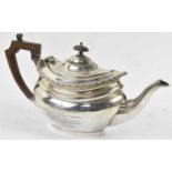 FORDHAM & FAULKNER; a George V hallmarked silver teapot with engraved presentation inscription dated