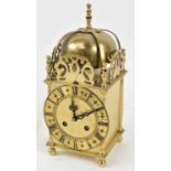 A brass cased mantel clock with Roman numeral dial, height 24cm.