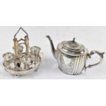 A late Victorian plated teapot with engraved decoration and an egg stand complete with four cups and