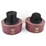 HERBERT JOHNSON; a gentleman's black silk top hat and a bowler hat, both cased, size 58.