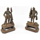 A pair of late 19th century cast iron figures of warrior, height 194cm.