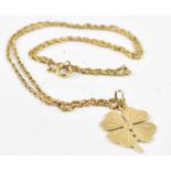 An 18ct yellow gold necklace with yellow metal four clover pendant, approx 5.8g.