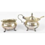 FARADAY & DAVEY; a late Victorian hallmarked silver oval mustard and matching salt, London 1900,