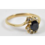 An 18ct yellow gold sapphire and diamond ring, size N, approx 2.5g.