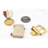 A men's Ferragamo gilt belt buckle, a Thorens zippo lighter, a Masonic medal and a Victoria 1887