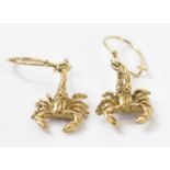 A pair of yellow metal earrings modelled as scorpions, approx 2.9g.