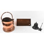 An copper circular gong, diameter 33cm with oak bracket, a copper coal scuttle and a cast iron