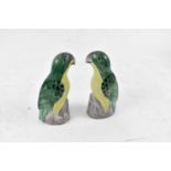 A pair of decorative figures of parrots in the Chinese style, height 18cm.