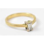 An 18ct yellow gold emerald cut diamond ring, size J/K, approx 2.3g.