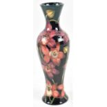 MOORCROFT; a blue glazed vase decorated with flowers from the Connoisseur Collection, June 2004,