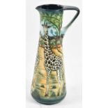 SIAN LEEPER FOR MOORCROFT; a limited edition dark green and blue glazed ewer decorated in 'Shimba'