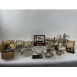 A quantity of plated items including cased set of four salts with spoons, two entree dishes,