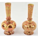 Two baluster vases decorated in copper lustre with Islamic inspired designs, height 22cm.Condition