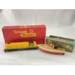 TRI-ANG; a boxed R155 diesel switcher in yellow livery, and a boxed Victoria tinplate clockwork