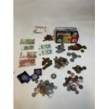A collection of various coins including commemorative crowns, some coppers, and various loose