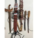 A group of tribal art, including a kris, other knives, etc.