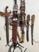 A group of tribal art, including a kris, other knives, etc.