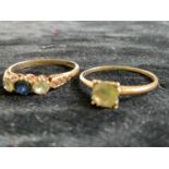 A 9ct yellow gold single stone dress ring and a 9ct yellow gold three stone dress ring, sizes M 1/