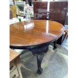 An early 20th century mahogany oval extending dining table with two additional leaves raised on