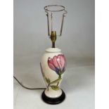 MOORCROFT; a large table lamp decorated in the 'Pink Hibiscus' pattern on a cream ground, height