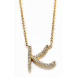 DAVID ROBINSON; an 18ct yellow gold trace chain, suspending a diamond set pendant with the