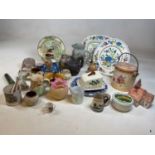 A quantity of decorative ceramics, including jugs, biscuit barrel, etc.