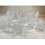 EDINBURGH CRYSTAL; a suite of glassware including thistle shaped glasses of various sizes, brandy
