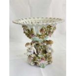 A large late 19th century Continental porcelain centrepiece with pierced circular bowl with