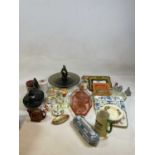 Three boxes of decorative ceramics and glass.