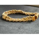 A 9ct two tone textured gold rope twist bracelet, length 19cm, approx. 20.6g.