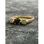 An 18ct yellow gold, sapphire and diamond three stone ring, size I 1/2, approx. 2.45g.