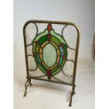 An early 20th century brass framed leaded stained glass fire screen (glass af).