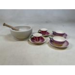 A pestle and mortar, diameter 22cm, and four modern Laura Ashley cups and saucers (5).